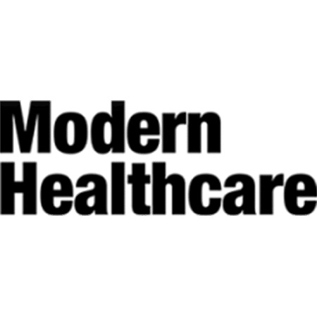 The image displays the words "Modern Healthcare" in bold, black capital letters on a light gray background.